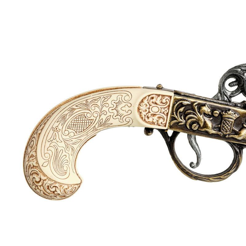 Gold 18th century flintlock pistol handlegrip close up