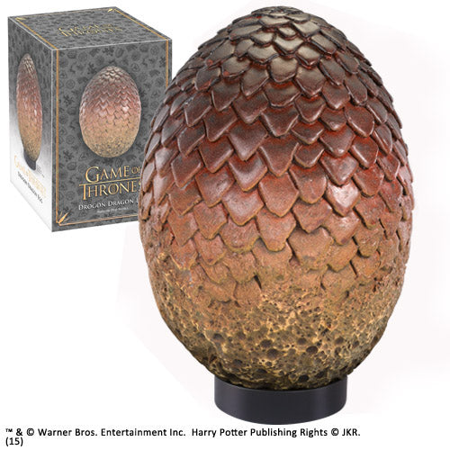 Drogon's dragon egg on black stand next to branded packaging