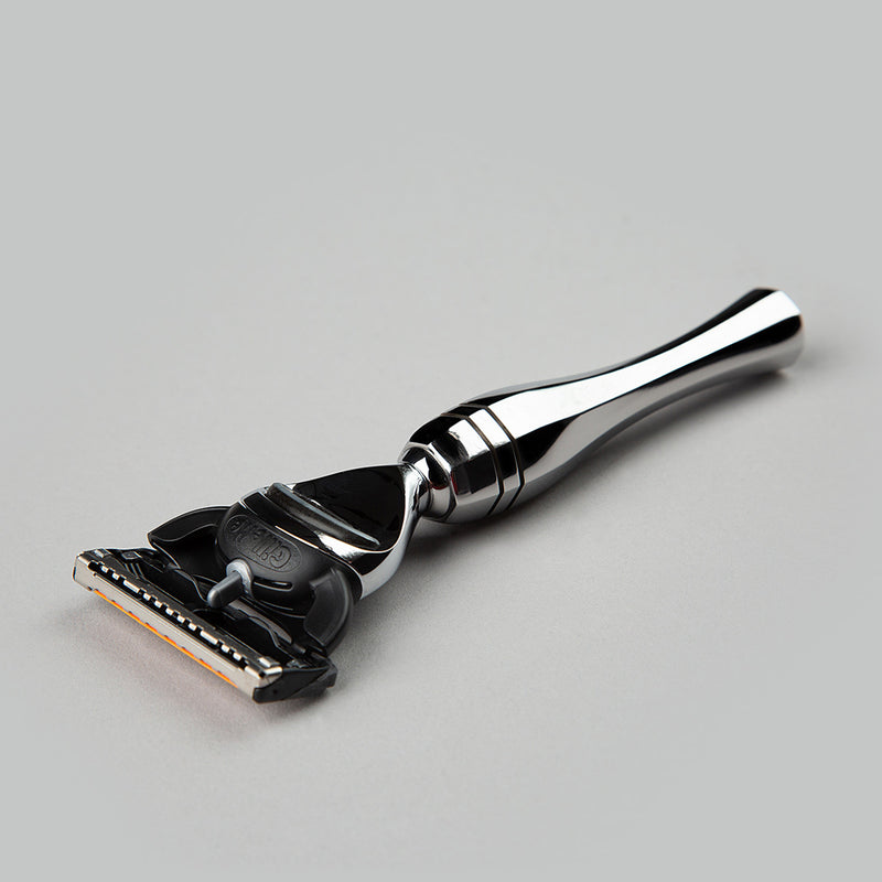 Line of Kings' Eltham Fusion Razor Lying on its side with full view of front left
