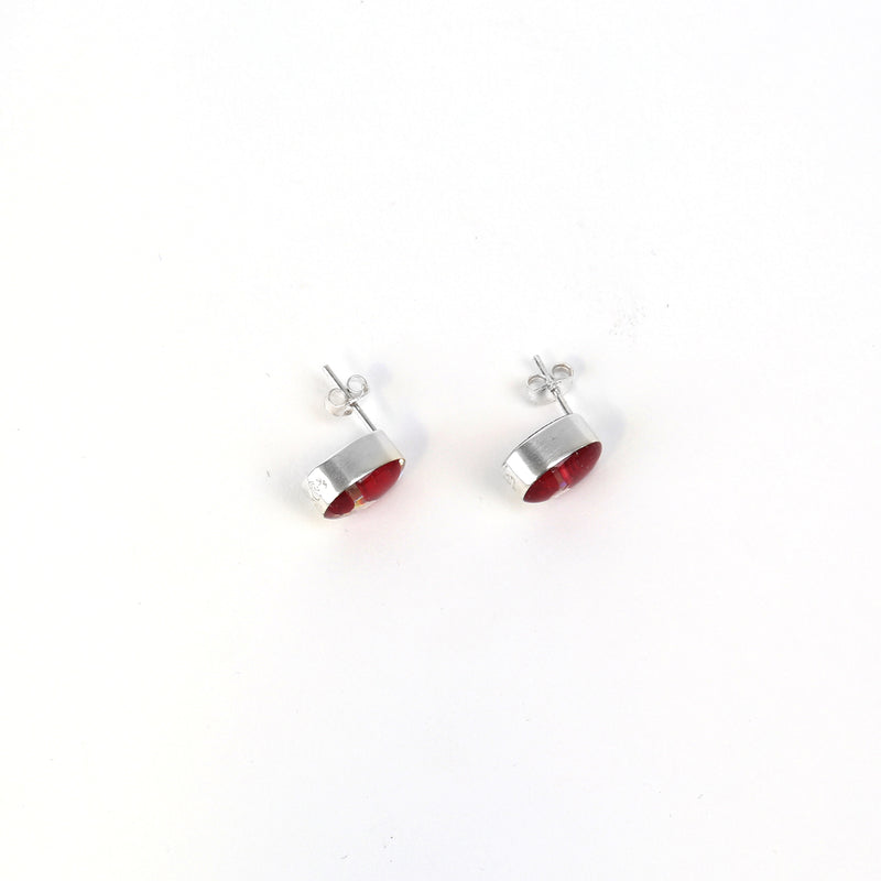 Oval poppy stud earrings from above