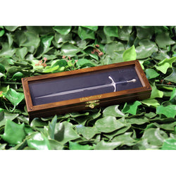 Glamdring sword replica letter opener in wooden display box laying on a bed of ivy 