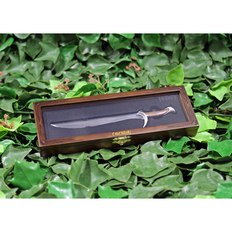 Orcrist replica letter opener in wooden display case on a bed of ivy