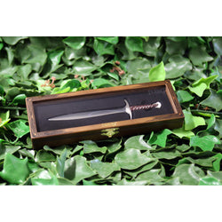 Sting sword replica letter opener in wooden display box on a bed of ivy