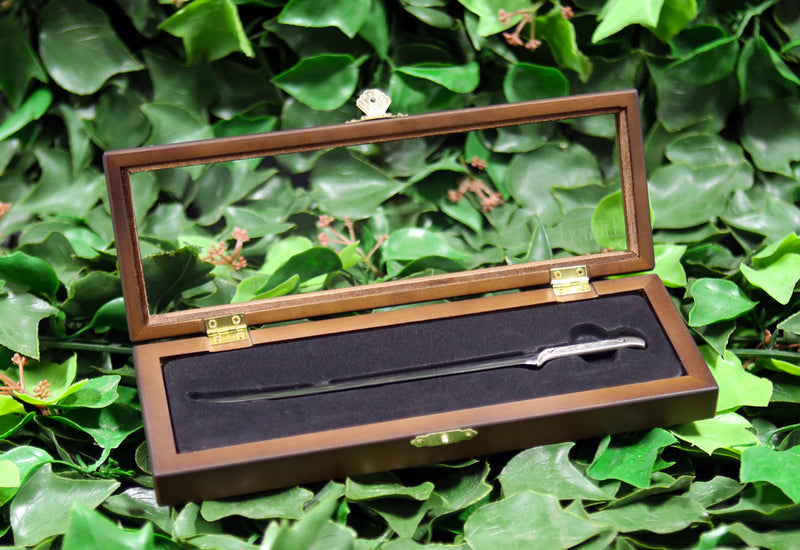 Thranduil’s sword letter opener in open wooden display box on a bed of ivy