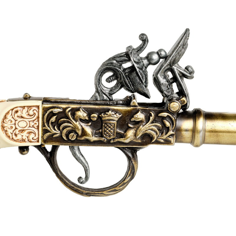 Gold 18th century flintlock pistol hammer and flintlock mechanism close up