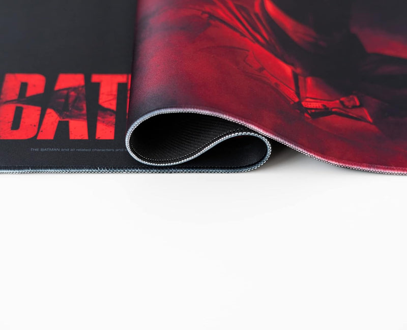 Roll of red and black mat with 'BAT' branding on a white background