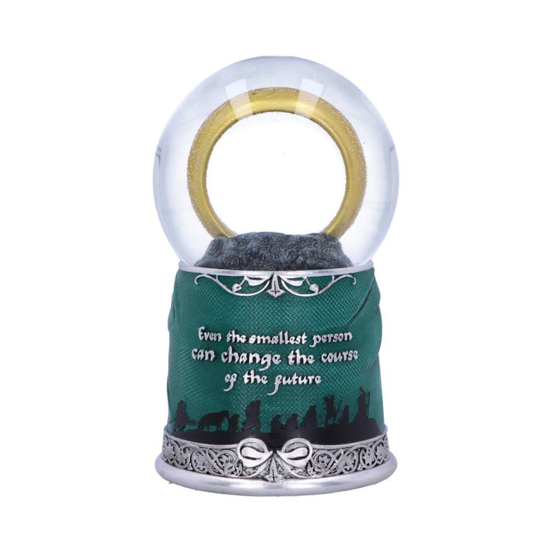 Decorative snow globe with green base and inspirational quote on a white background