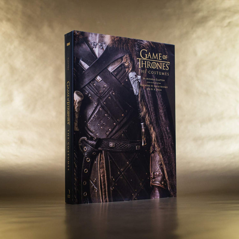 Game of Thrones: The Costumes: The official costume design book of Season 1 to Season 8 by Michelle Clapton stood upright