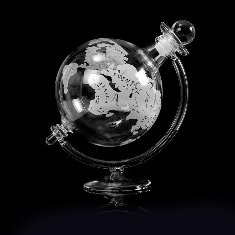 globe shaped decanter on black background