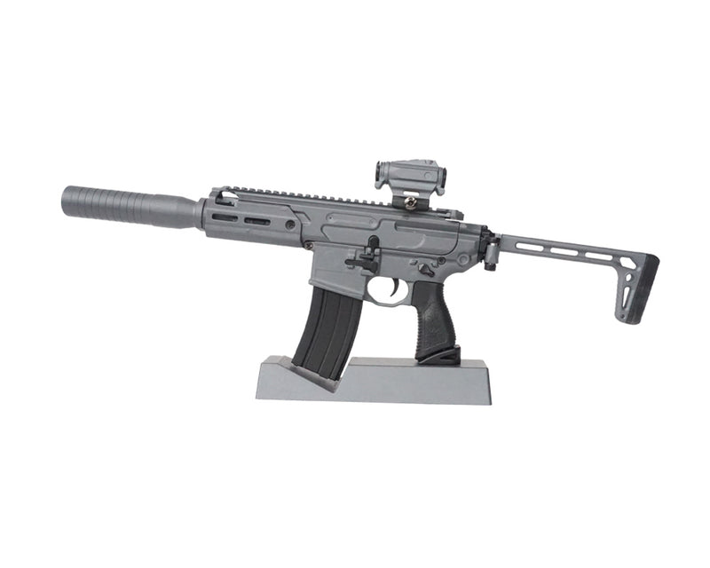 Stone grey SIG MCX model on its display stand facing towards the left hand side