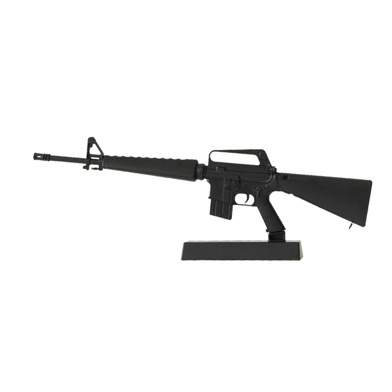 Model of a black M16A1 on a black display stand pointing to the left