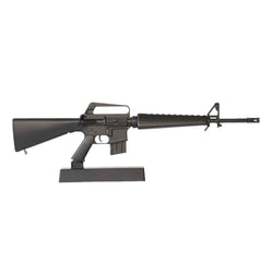 Model of a black M16A1 on a black display stand pointing to the right