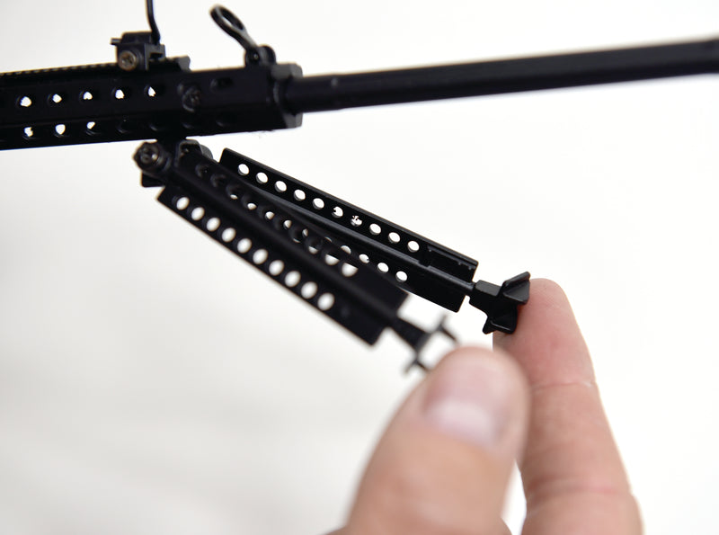 Closeup of the M82A1 model. There is a hand folding away the bipod