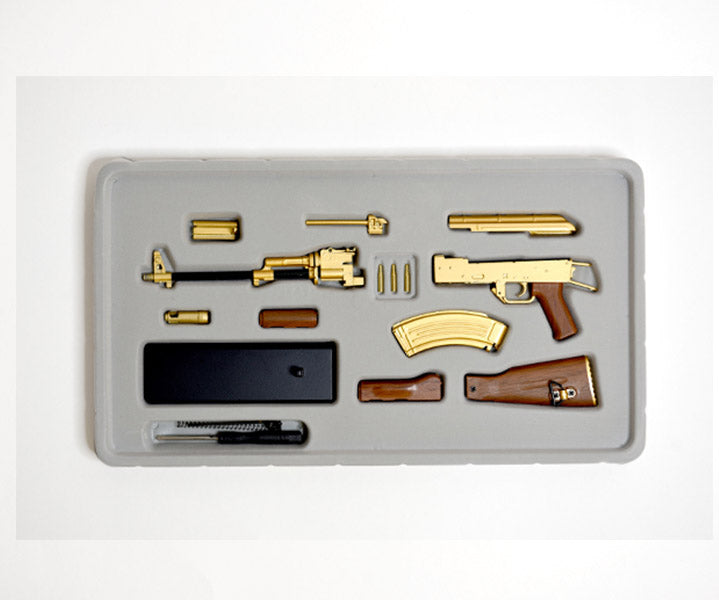 Package contents of unassembled gold plated AK47 model kit