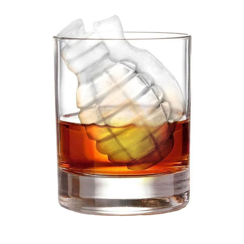 grenade shaped ice cube in a glass with amber liquid