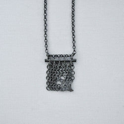 distressed silver chain main pendant and chain with the appearance of being melted in parts