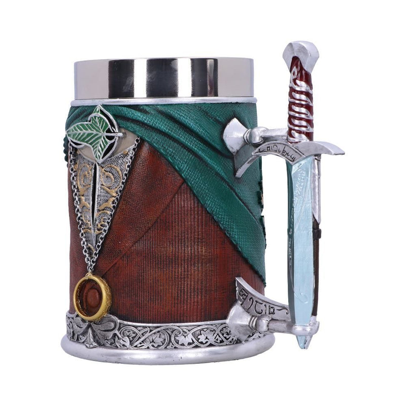 A sideview the handle side of a steel tankard made in the image of Frodo Baggins. The tankard is wearing an emerald green cape, a brown waistcoat, a silver and gold undershirt and a cloak pin in the shape of a leaf. The handle is in the shape of 'Sting', Frodo's sword, and is painted blue as if glowing.