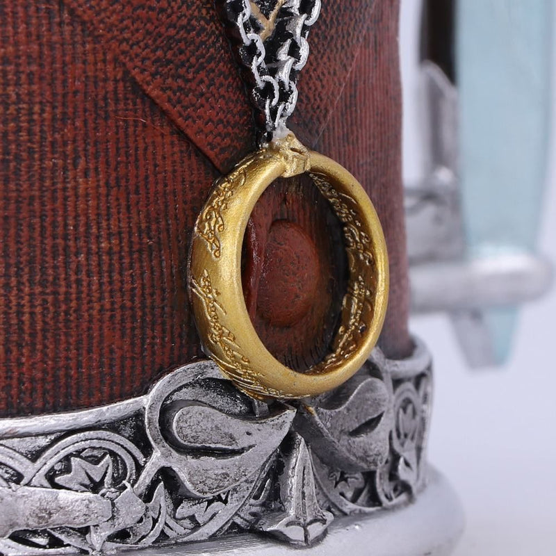 Close up of the One Ring hanging from the neck of the Frodo Tankard. Elvish inscription can be seen carved into both sides of the ring.