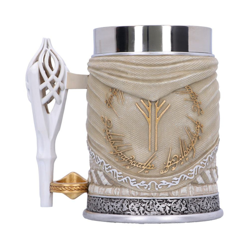 Decorative mug with intricate designs and a white handle on a white background