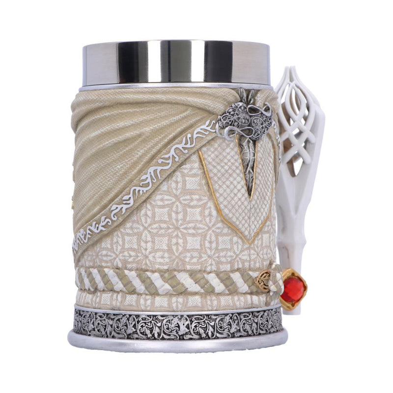 Decorative mug with intricate patterns and a white handle on a white background