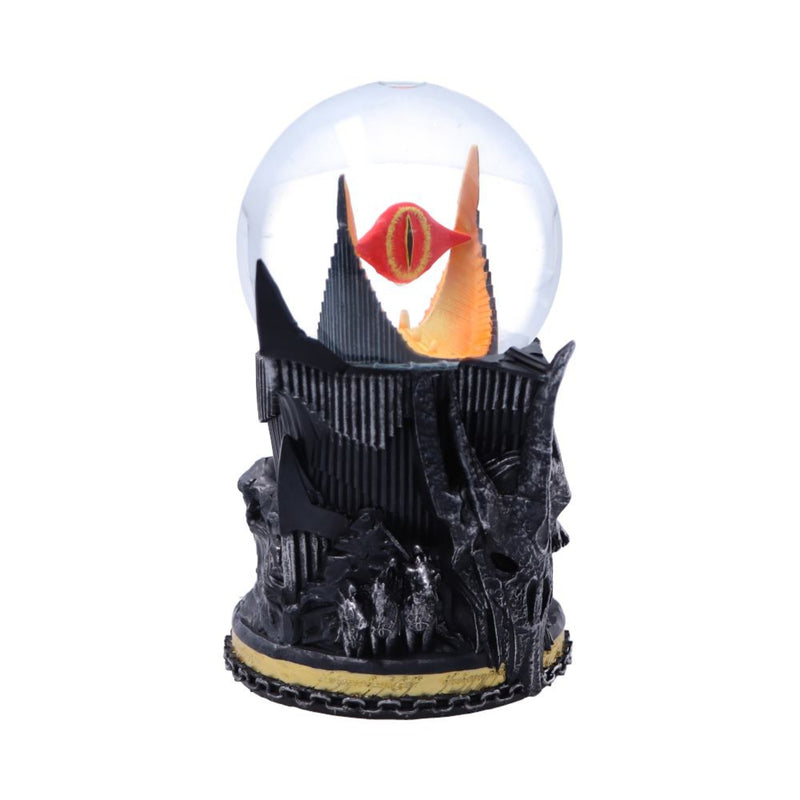 Decorative snow globe with a dark castle and eye design on a white background