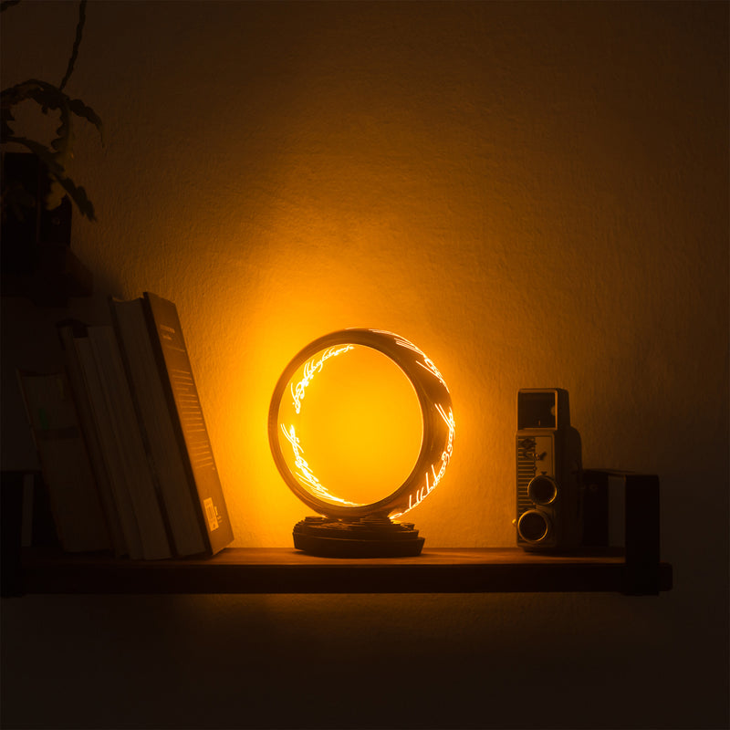 lord of the rings one ring lamp on shelf
