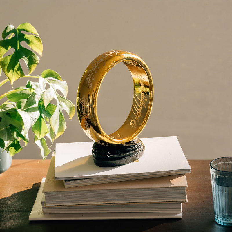 lord of the rings one ring lamp on stack of books