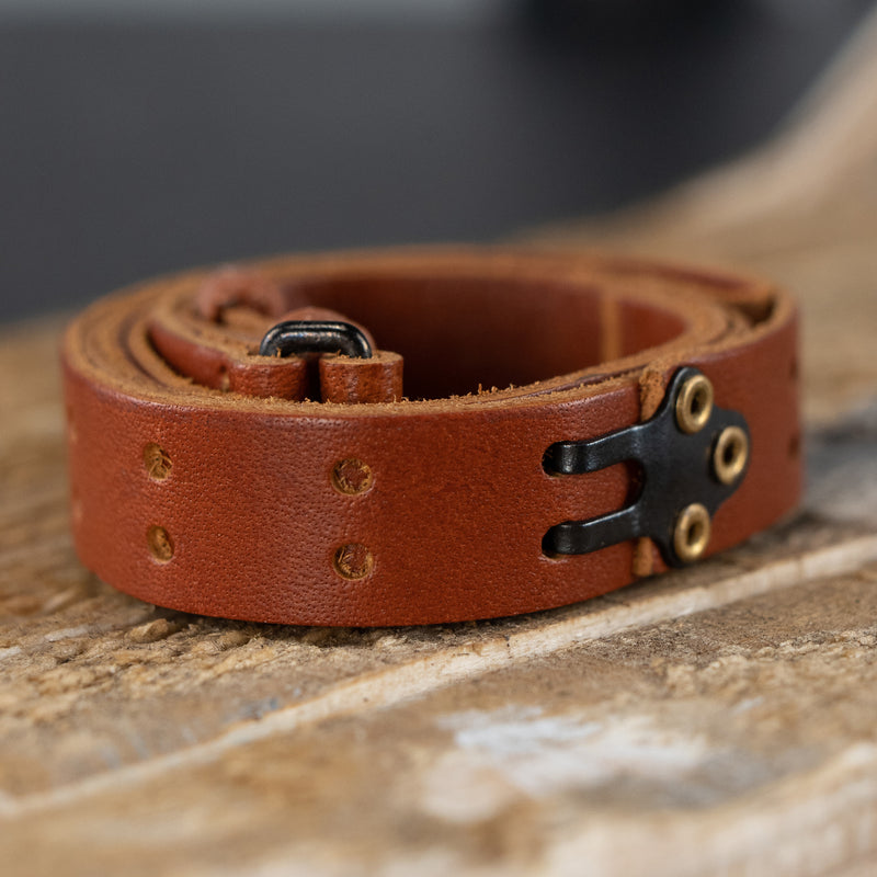 Close up of the M1 Garand leather gun strap. The Leather strap is displayed coiled into a circle