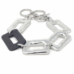 Medium Ring Feature Linked Bracelet with One Black Leather Piece- full view from above