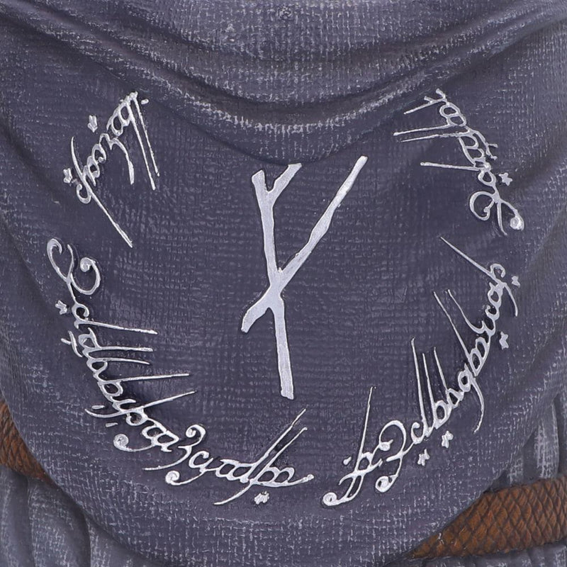 Textured surface with white script and a central design resembling a key.