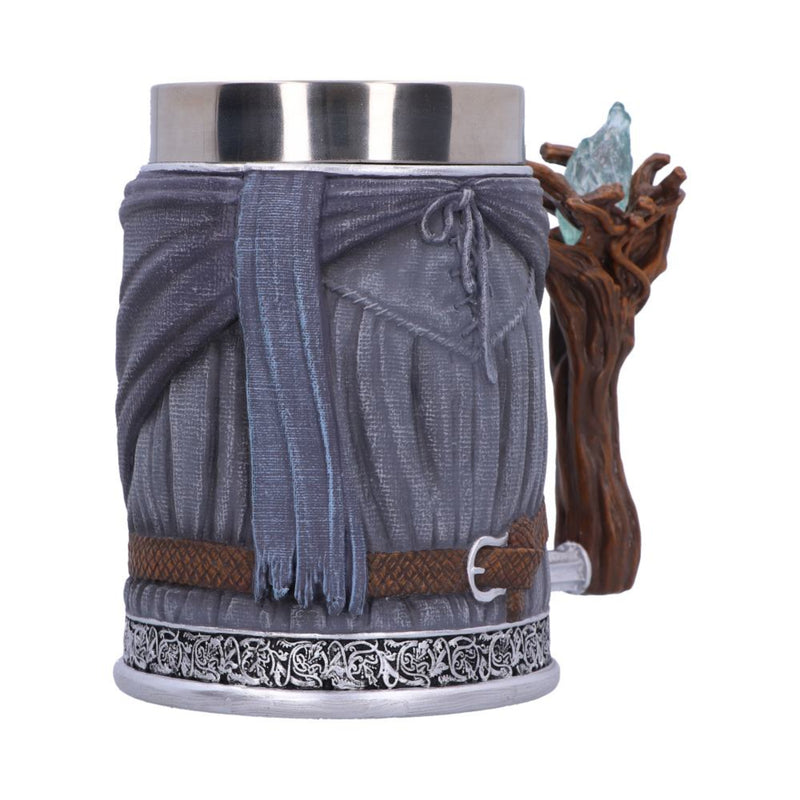Decorative mug with fringed design and wooden handle on a white background