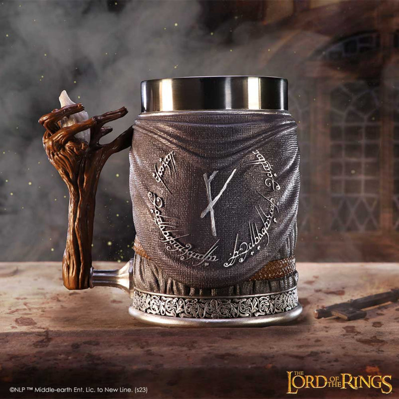 Decorative mug with Elvish script and a wooden handle on a wooden surface, with 'The Lord of the Rings' branding.