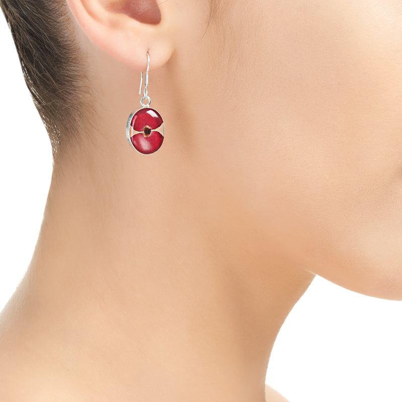Oval poppy drop earrings on model