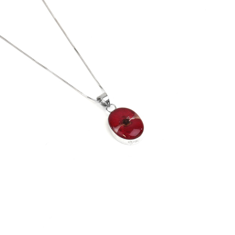 Oval poppy pendant necklace close up