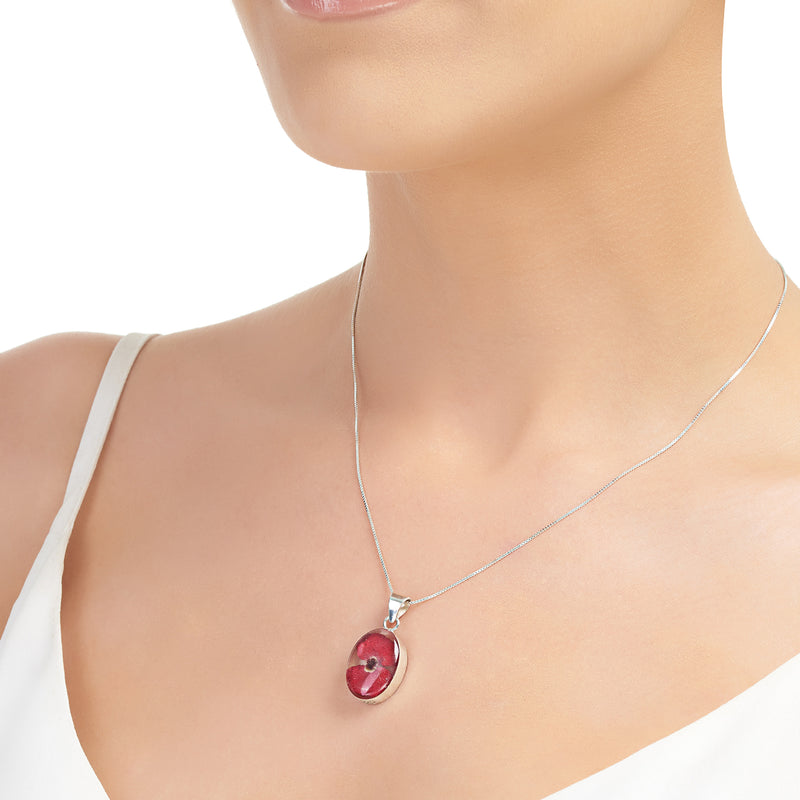 Oval poppy pendant necklace on model