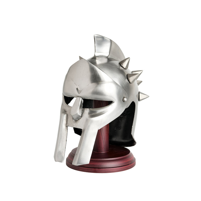 Side view of a miniature silver roman gladiator helmet displayed on a stand
