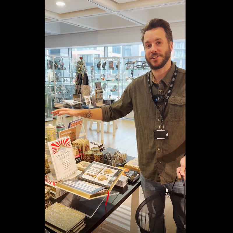 Royal Armouries Assistant Curator of Arms and Armour, Scott Hurst, with the Headstamp Swords of the Emperor book in the museum shop