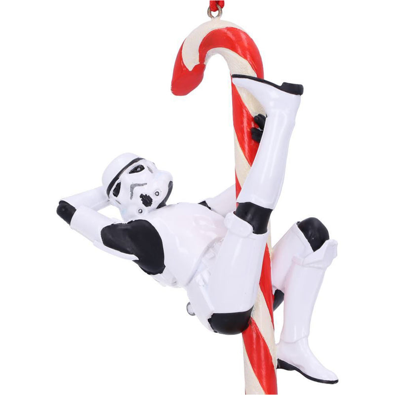 Stormtrooper posed hanging off a candy cane hanging decorative ornament front right closeup view