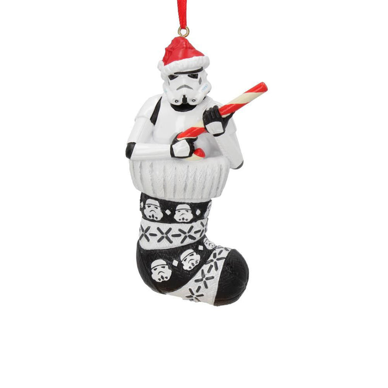 Stormtrooper in a stocking holding a candy cane like a blaster hanging decoration