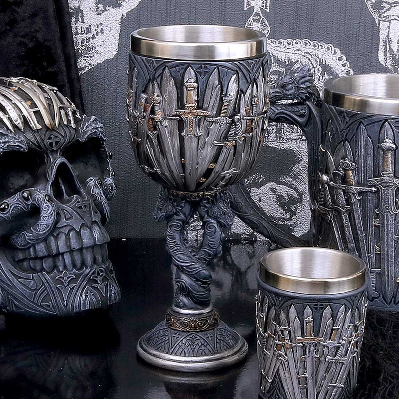 Sword and Dragon Goblet Displayed on desk with skull and other dragon cups