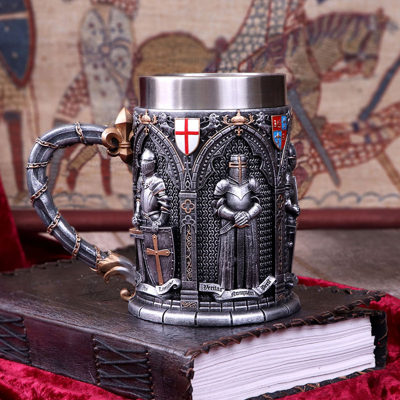 The Vow Tankard resting on leather bound book in front of a tapestry