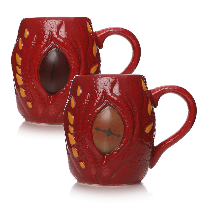 Red smaug mug with yellow details. Two pictures of the mug showing colour difference between hot and cold. One eye is a dark burgundy and one is a vivid orange