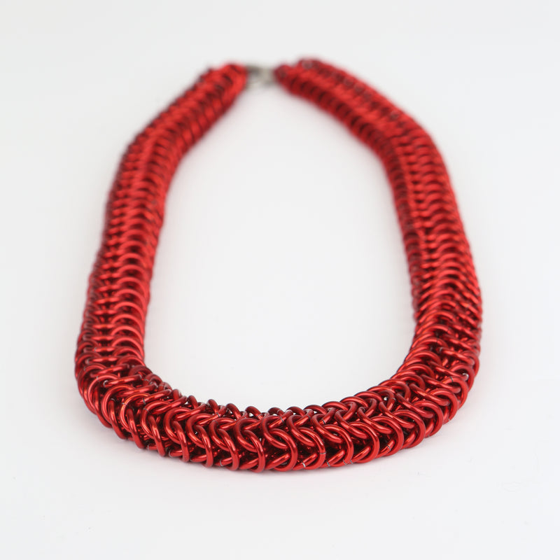 Intricately linked chunky chainmail necklace in crimson red - closeup of chain links