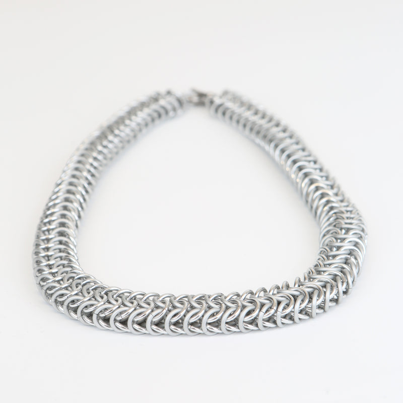 Intricately linked chunky silver chainmail necklace - closeup of chain links