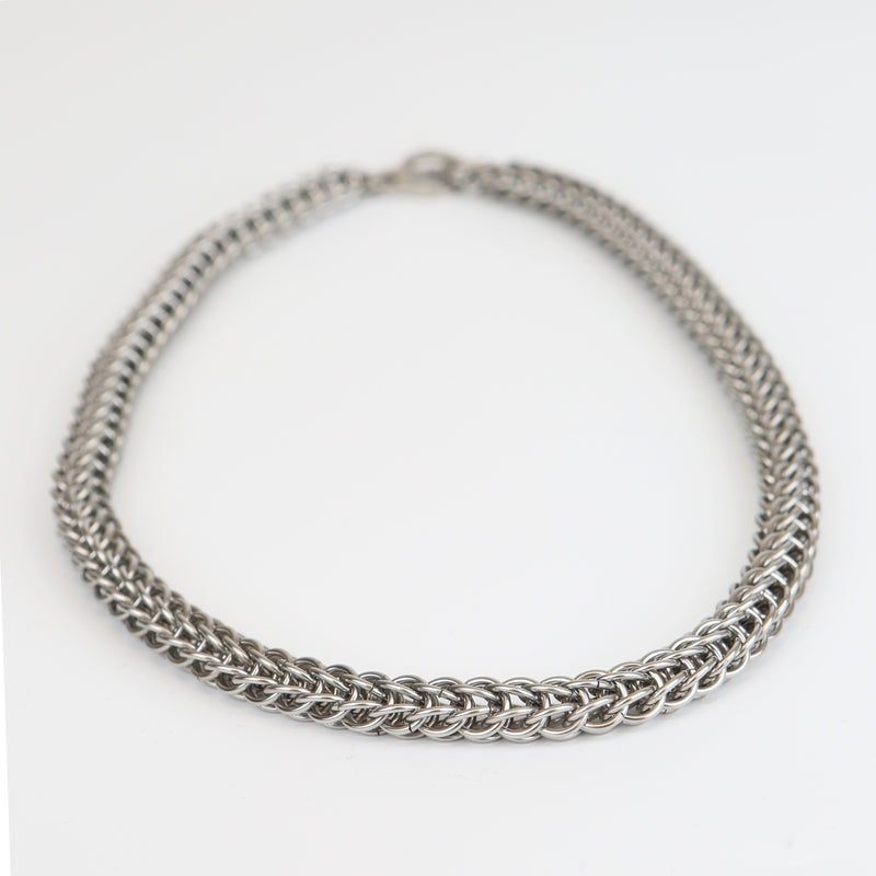 Intricately linked chunky silver chainmail necklace - closeup of chain links