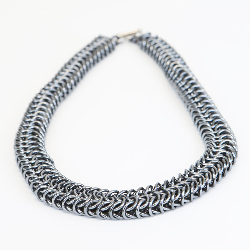 Intricately linked chunky gun metal silver necklace - closeup of chain links