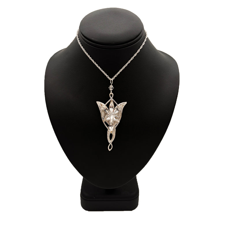 Silver fairy pendant necklace on a black mannequin bust