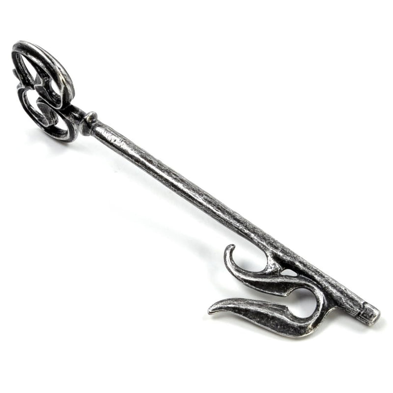 Decorative aged silver colour key on a white background