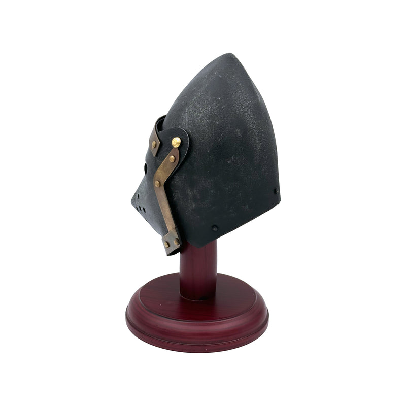 Medieval pigface helmet on a wooden stand against a white background
