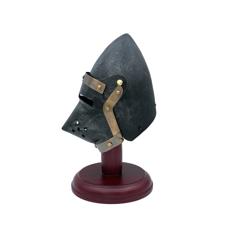 Medieval-style helmet on a stand with a white background